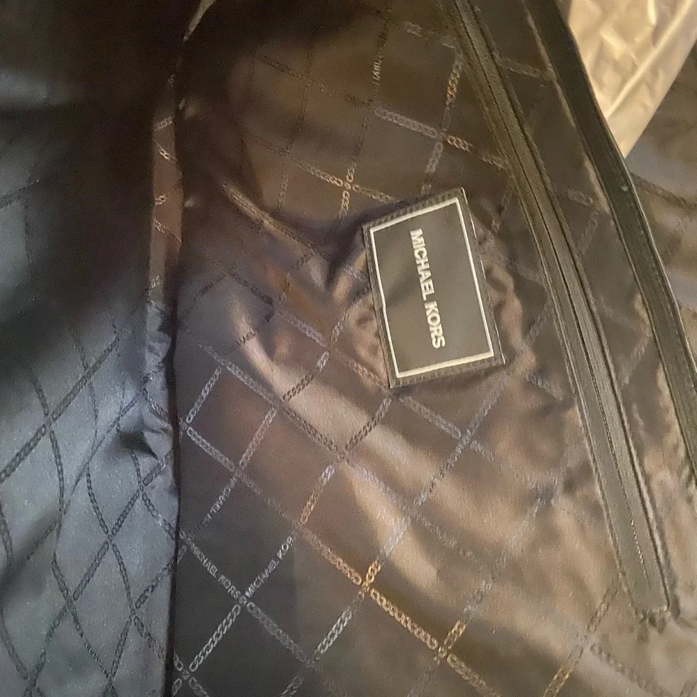 Authentic Michael, Kors, laptop case black on black in color brand new with tag